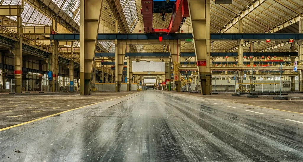Large factory hall with production equipment along a central aisle