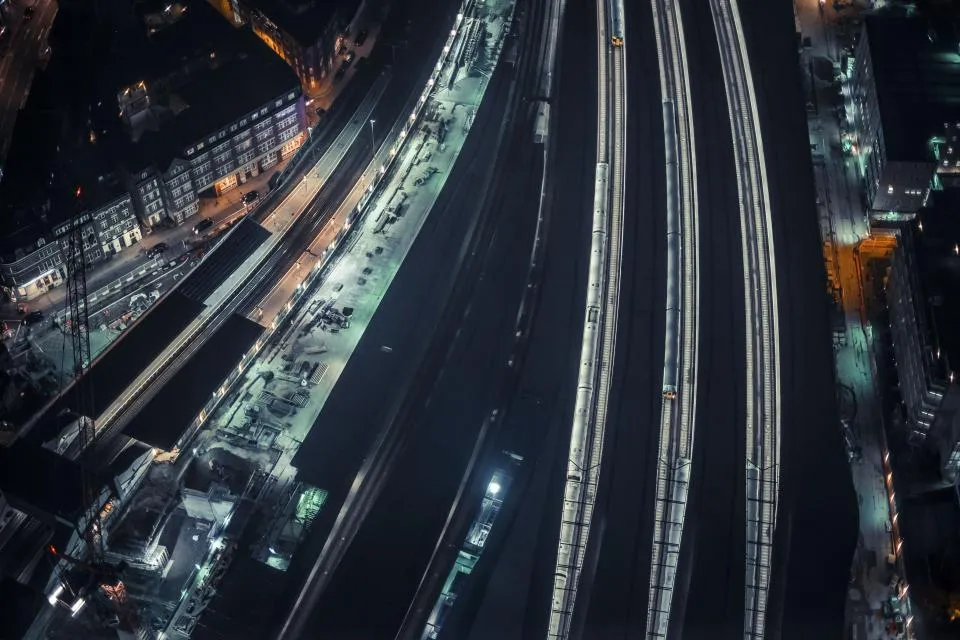 Long-exposure light trails of traffic on a highway at night